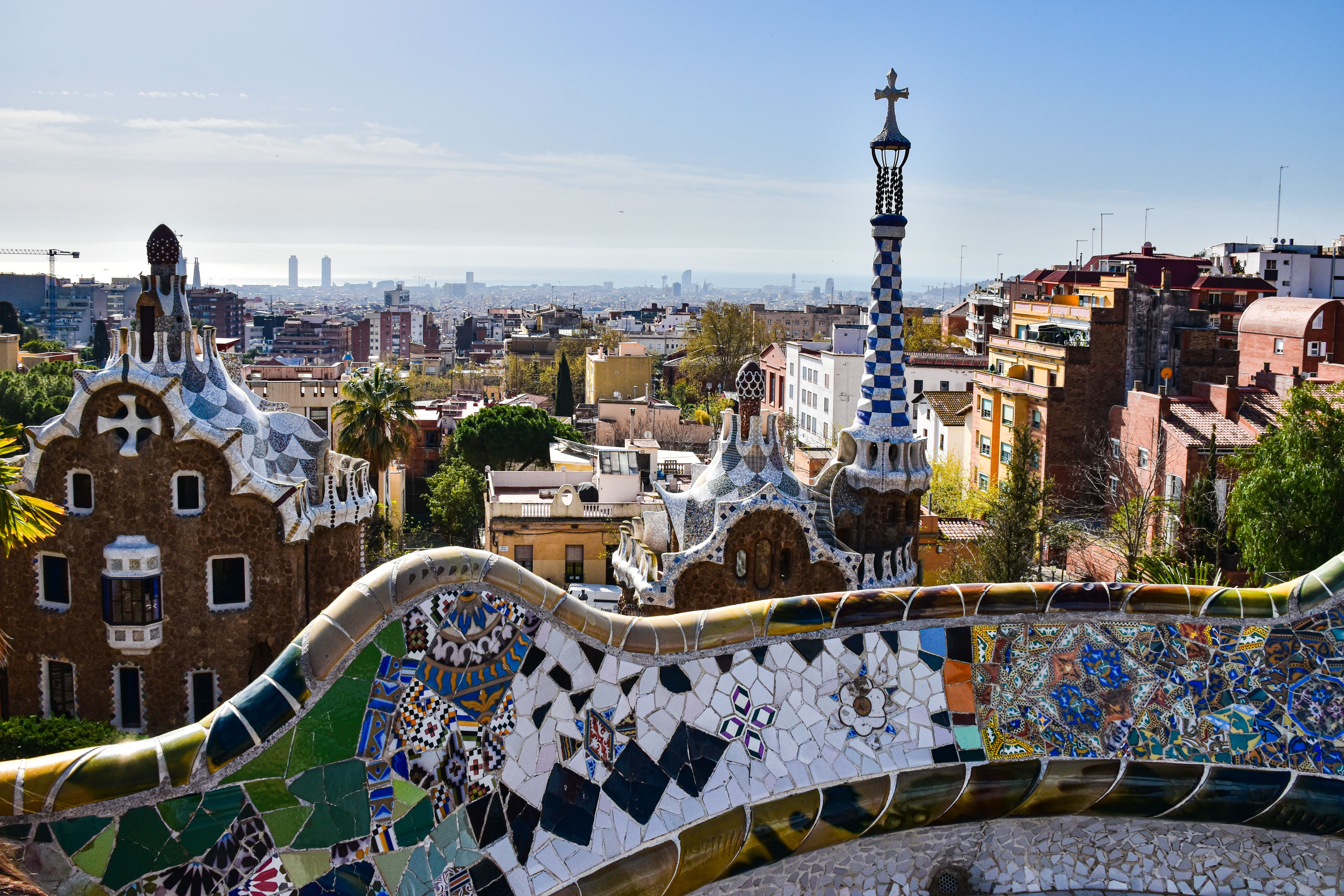 Mosaic terrace at Park Güell with Barcelona skyline